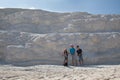 Three children with dog on background limestone wall of Pamukkale Royalty Free Stock Photo