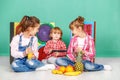 Three children with fruit. The concept of a healthy lifestyle, f