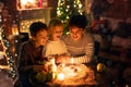 Three children, lighting candles in a nutshell, czech Christmas traditions