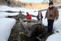 Three children near a Large monumental fountain with cold water Royalty Free Stock Photo