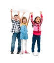 Three children with open mouths holding empty sheet of paper