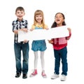 Three children with open mouths holding empty sheet of paper