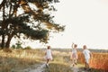 Three children playing in the field in summer. young children playing outdoors smiling. happy family. carefree childhood Royalty Free Stock Photo