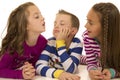 Three children playing laying down with silly expressions Royalty Free Stock Photo