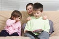 Three children reading book Royalty Free Stock Photo