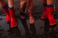 Children after the rain with rubber boots