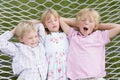 Three children relaxing and sleeping in hammock Royalty Free Stock Photo