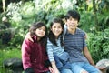 Three children sitting outdoors Royalty Free Stock Photo