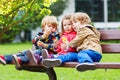 Three children: two little boys and one girl hugging. Royalty Free Stock Photo