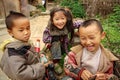 Three Chinese children having fun near the farmhouse, Basha Miao Village, Congjiang County, Southeast Guizhou Province, Southwest