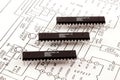 Three chip situated on schematic background