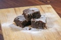 Three chocolate brownies dusted with powdered sugar Royalty Free Stock Photo