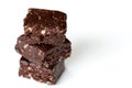 Three Chocolate Fudge Squares Stacked on White Background