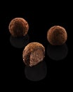 Three chocolate truffles with filling Royalty Free Stock Photo