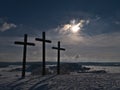 Three Christian crosses on the top of KornbÃÂ¼hl hill near Burladingen in low mountain range Swabian Alb with winter landscape. Royalty Free Stock Photo