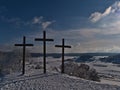 Three Christian crosses on the top of KornbÃÂ¼hl hill, Germany in low mountain range Swabian Alb with beautiful winter landscape. Royalty Free Stock Photo