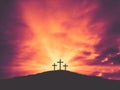 Three Christian Easter Crosses on Hill of Calvary with Colorful Clouds in Sky