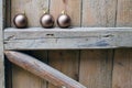 Three Christmas balls on old wooden background wall. Royalty Free Stock Photo