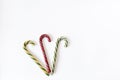 Three Christmas decorative candy canes isolated on white background. Copy space