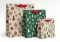 Three christmas gift bags in different sizes and designs Royalty Free Stock Photo
