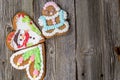 Three Christmas Gingerbread Cookies on Wooden Table on Wooden Table Royalty Free Stock Photo