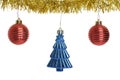 Three christmas ornaments on gold garland Royalty Free Stock Photo