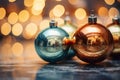 three christmas ornaments on a table in front of a bokeh background Royalty Free Stock Photo