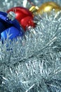 Three christmas sparkling spheres on a tinsel Royalty Free Stock Photo