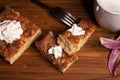 Three Churro Cheesecake pieces, one fork and a drink on a wooden base Royalty Free Stock Photo