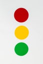 Three circular filters in red, yellow, and green colors in line on white background.