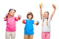 three classmates having fun and showing painted hands with smiley icons Royalty Free Stock Photo