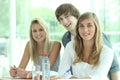 Three classmates revising together Royalty Free Stock Photo