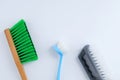 Three cleaning brushes handle. White background Royalty Free Stock Photo