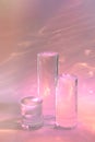 three clear glass cylinder podiums on pastel pink background