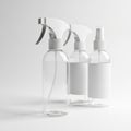 Three Clear Plastic Spray Bottles with White Triggers and Labels on White Background Royalty Free Stock Photo