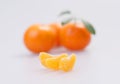 Three clementines with segments