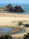 Three Cliffs Bay, Gower with beach and tidal pool Royalty Free Stock Photo