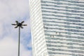 Three climbers wash windows and glass facade of the skyscraper Royalty Free Stock Photo