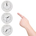 Three clock. Finger points to the clock Royalty Free Stock Photo