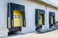 Three closed truck loading docks at a warehouse