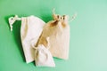 Three cloth bags on green background
