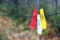Three clothespins hanging on a rope Royalty Free Stock Photo