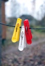 Three clothespins hanging on a rope Royalty Free Stock Photo