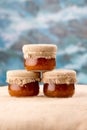 Three cloudberry jam jars