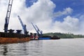 Three coal barge was unloading cargo at the port Royalty Free Stock Photo