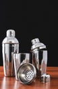 Three cocktail shakers for making summer cocktails at the bar. European shaker in disassembled form: glass, sieve, lid