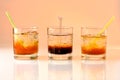 Three cocktails on orange background Royalty Free Stock Photo