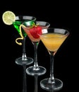 Three cocktails red cosmopolitan cocktails decorated with citrus Royalty Free Stock Photo