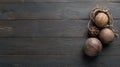 Three Coconuts Arranged on a Rustic Wooden Table with Ample Space for Text on the Right Side Royalty Free Stock Photo