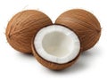 Three coconuts, one opened revealing white interior Royalty Free Stock Photo